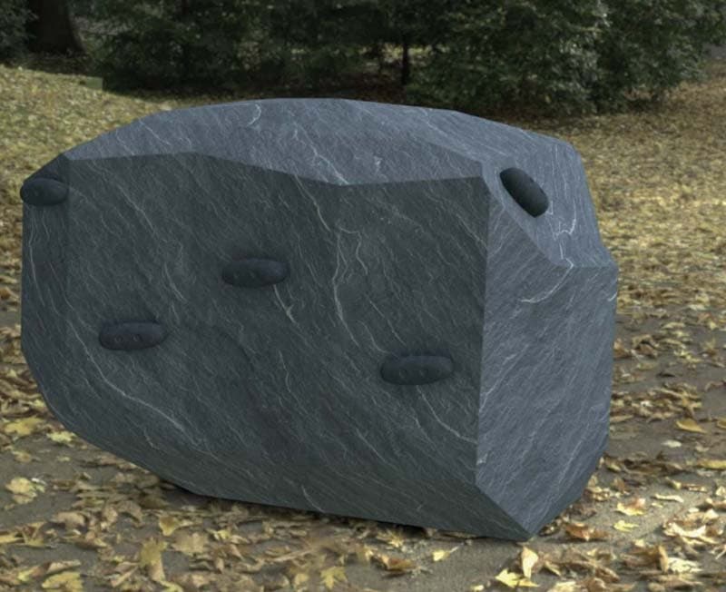 Small rock climberwith climbing hold
